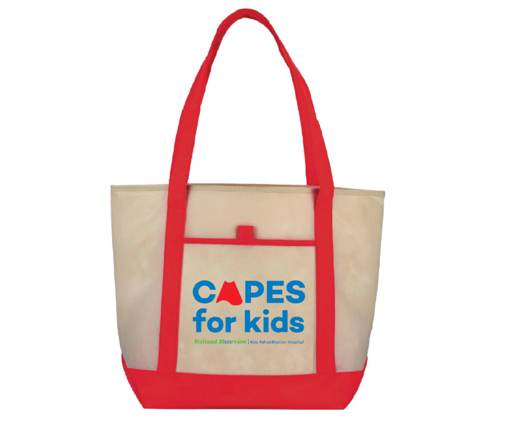 Cream tote bag with red handles and blue Capes for Kids logo